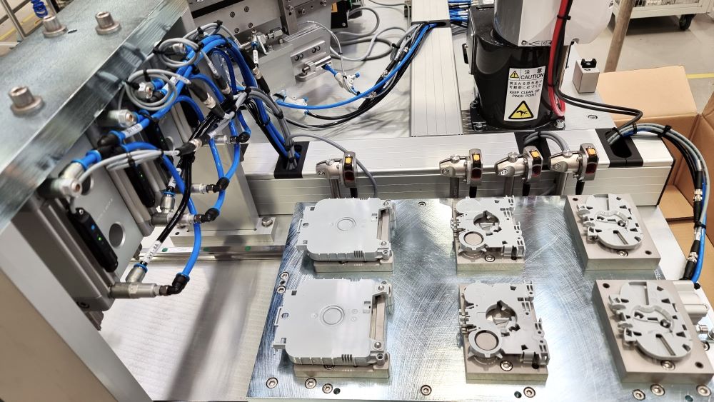 Automatic Insertion Cell - 6 Axis Robot assembles three sets of moulding parts